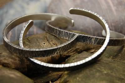 Three etched silver bracelets